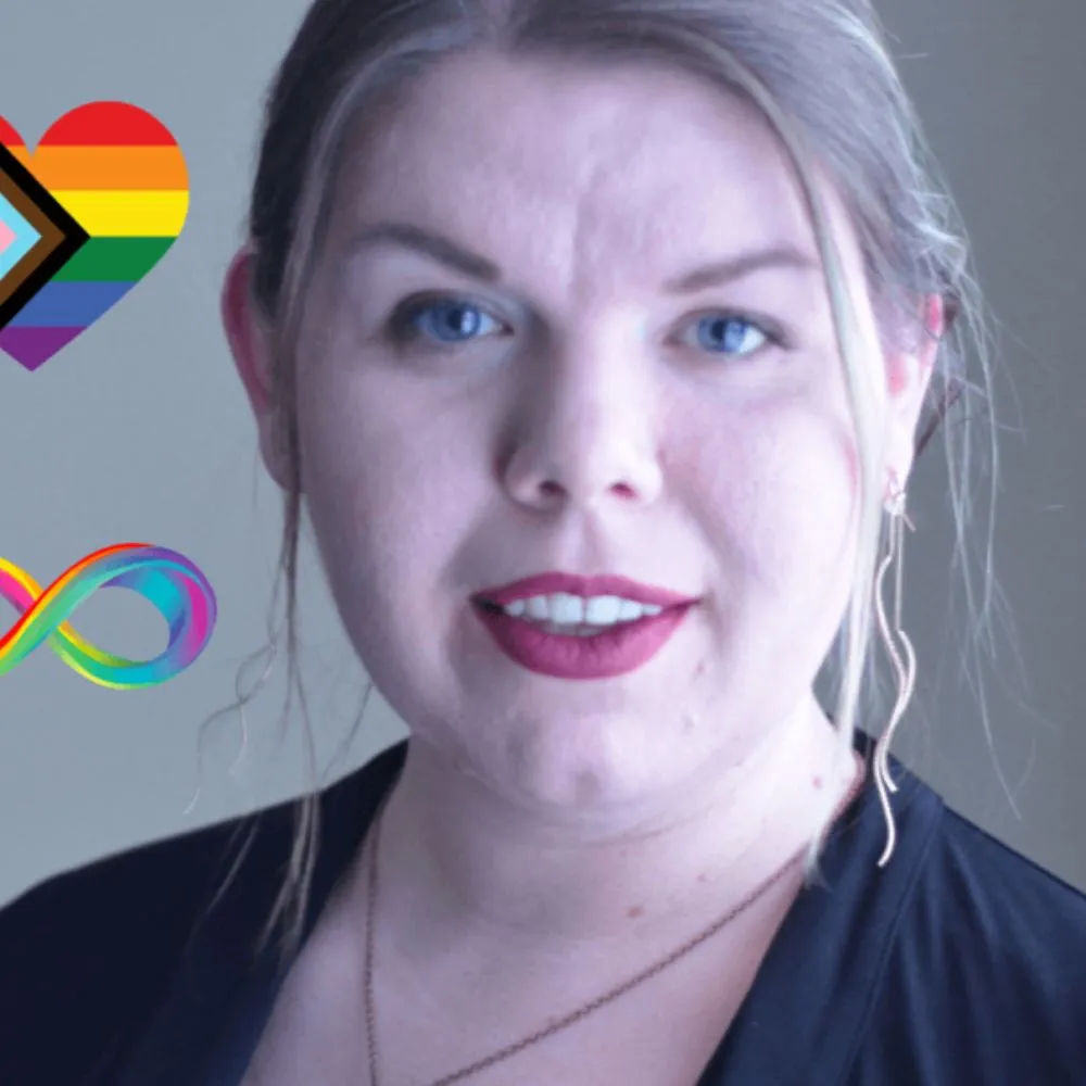 Portrait of a blonde person with rainbow and infinity symbols beside them.