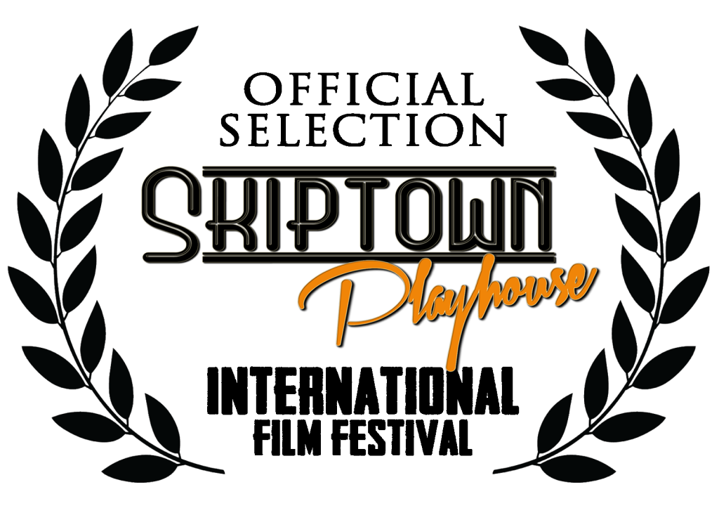 SkipTown Playhouse film festival laurel featuring black leafy branches surrounding the SkipTown Playhouse logo, with orange script lettering.